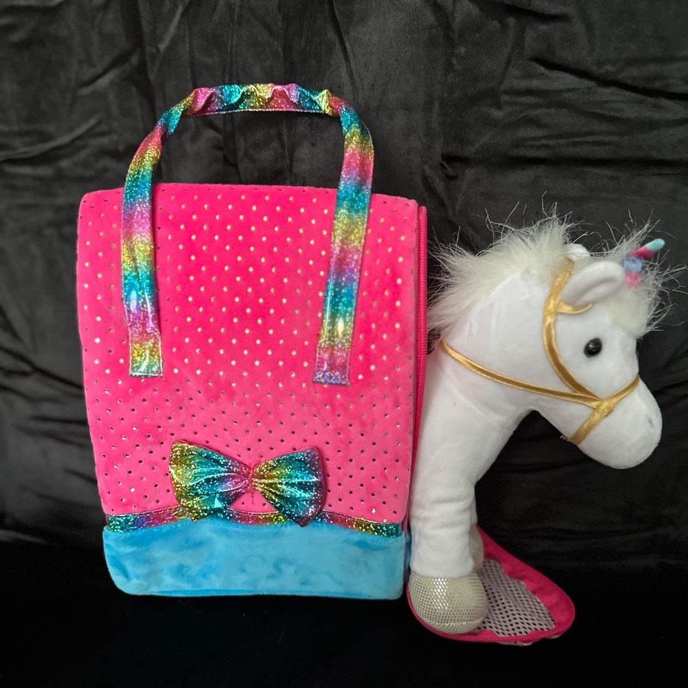 Pet in a bag, travel bag with white unicorn stuffy.